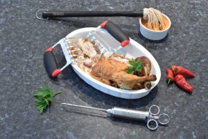 Premiala Meat Injector, Meat Claws and Basting Mop helping create a juicy roast chicken